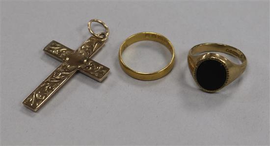 A 22ct gold wedding band, a 9ct gold signet ring and a 9ct gold cross pendant.